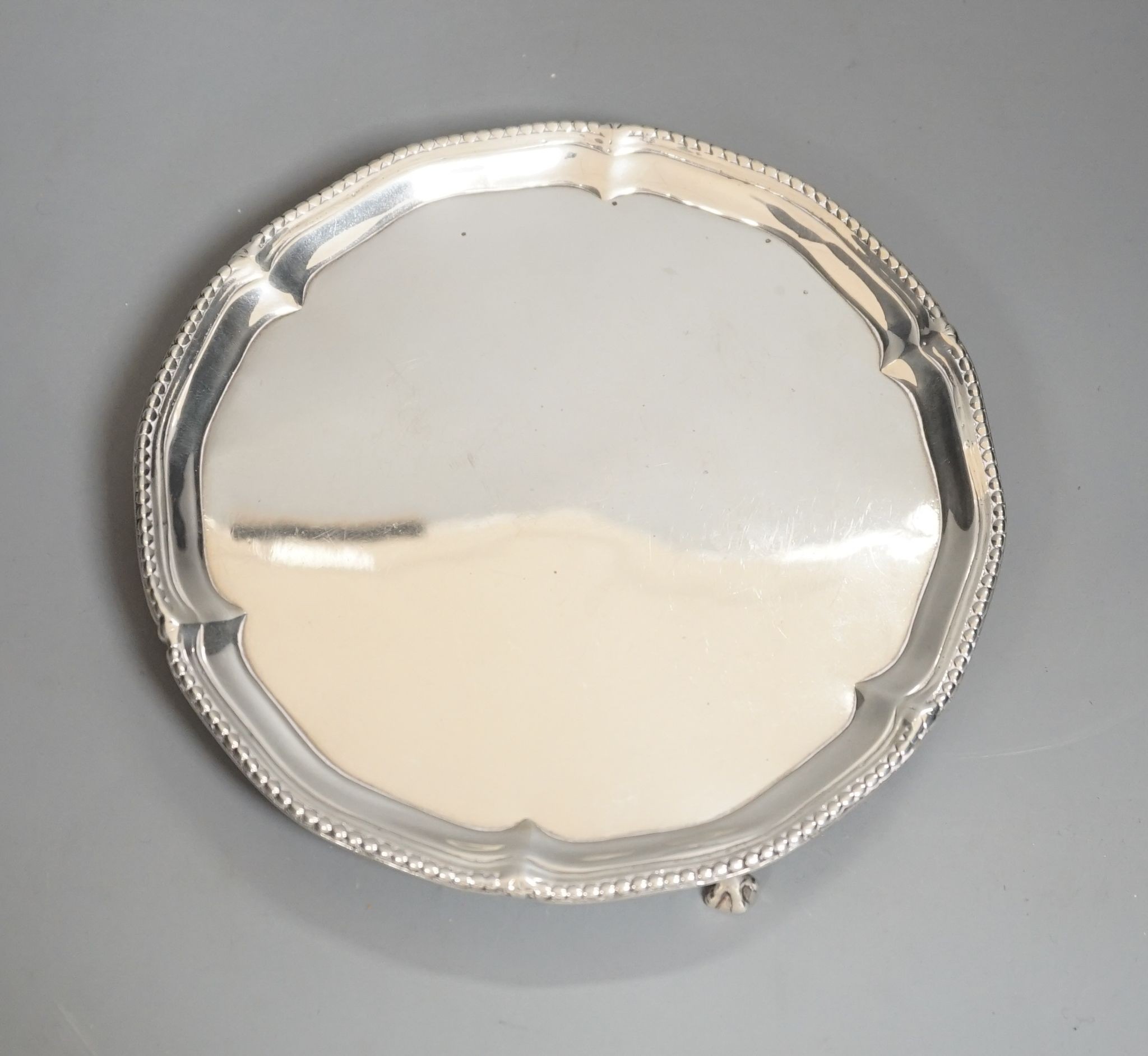 A George III silver waiter, on three claw feet, John Chapman II, London, 1774, 17.9cm, 8oz (repair).